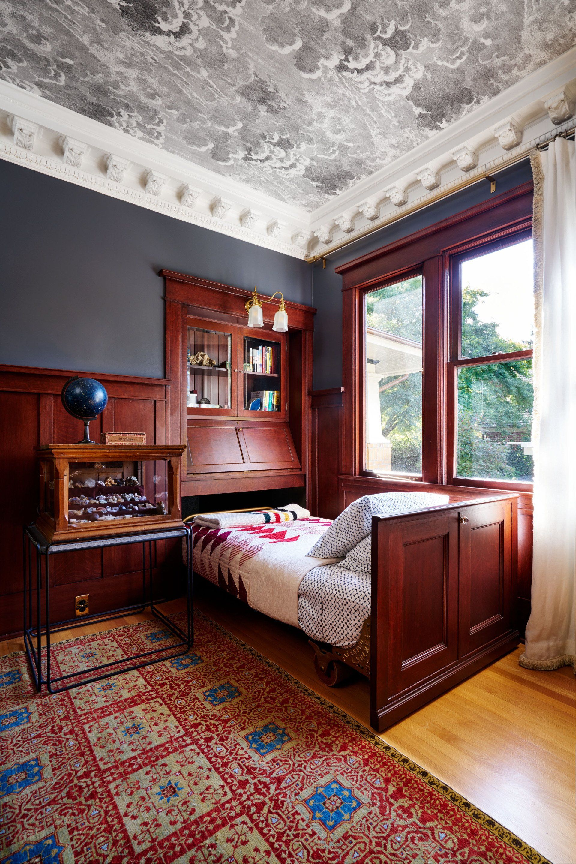 The pull-out guest bed was designed to rest under the window.