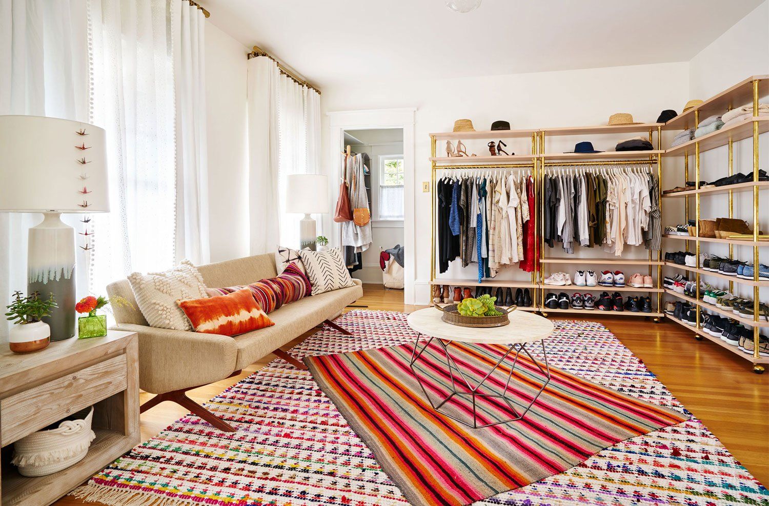 We made a bedroom into a dressing room and closet, adding custom brass and spruce clothing racks.