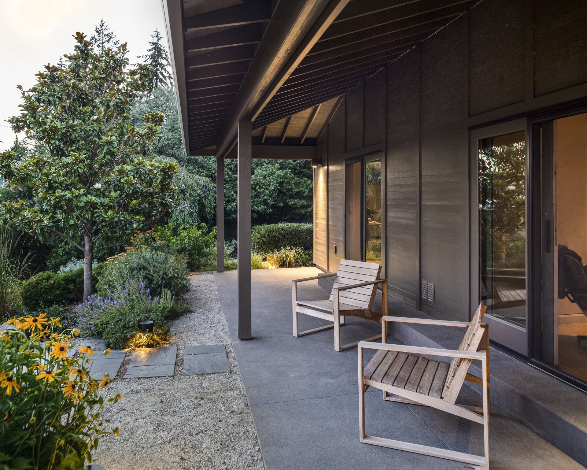 The covered patio provides a shelter from the weather, right outside living spaces.