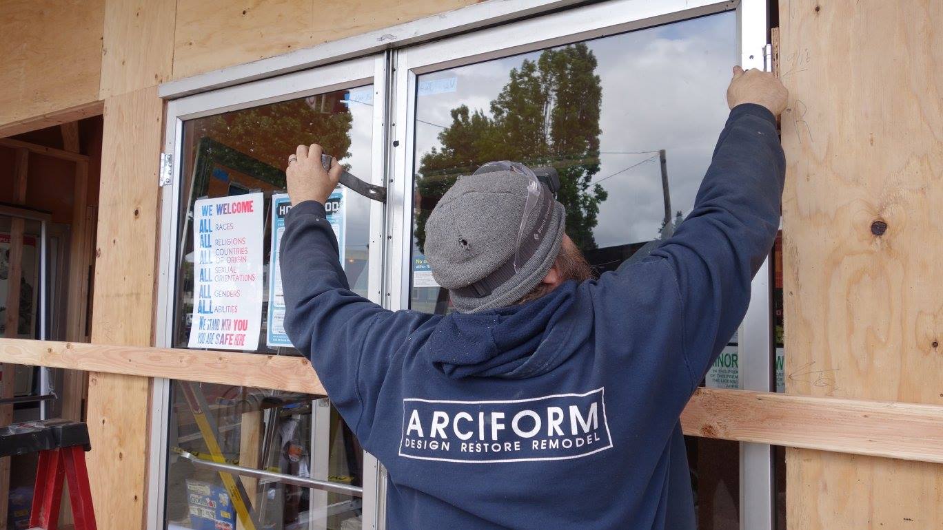 Site Lead Jamie Whittaker removes the old storefront system