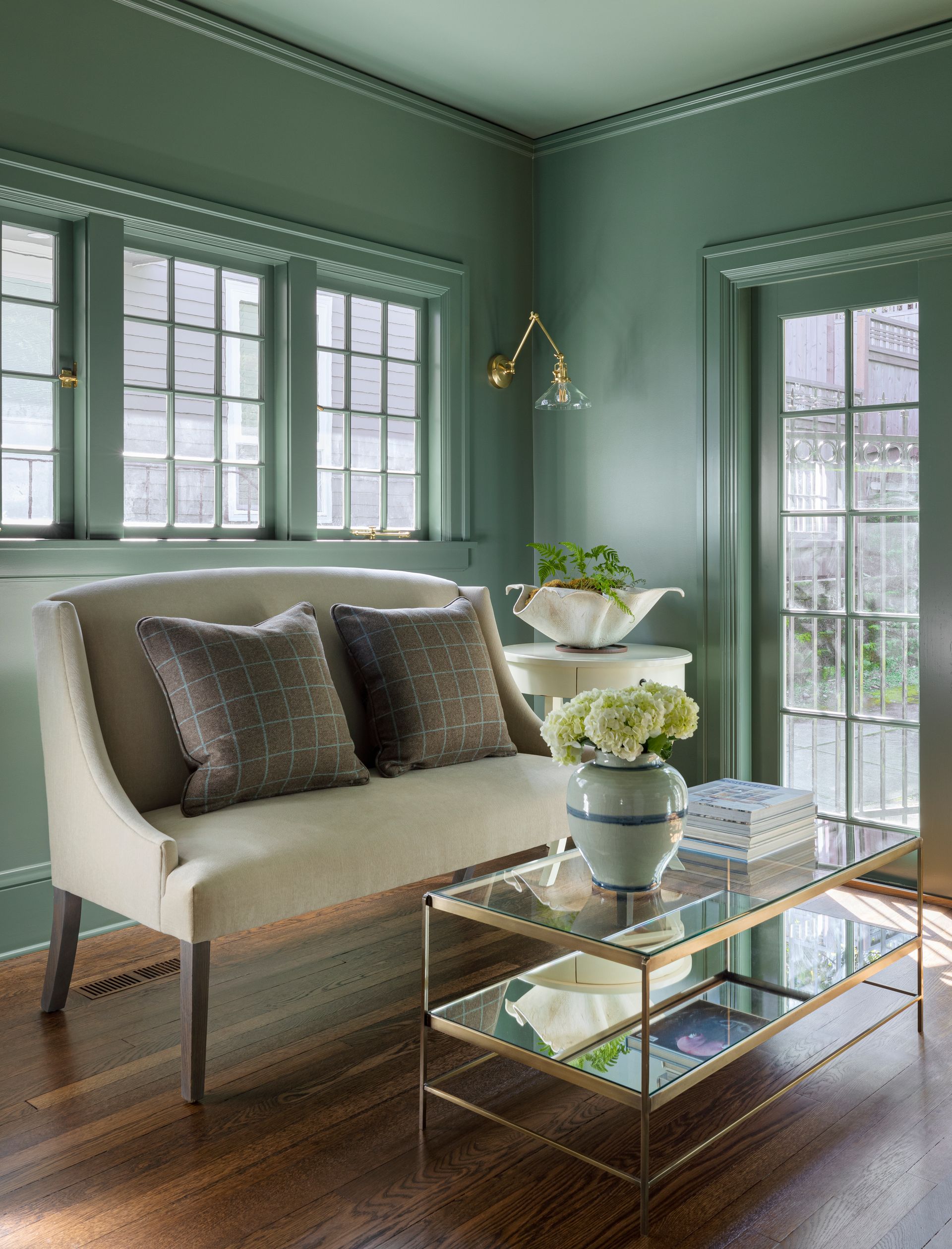 The smoky green parlor gets amazing southwestern light and has a backyard view.