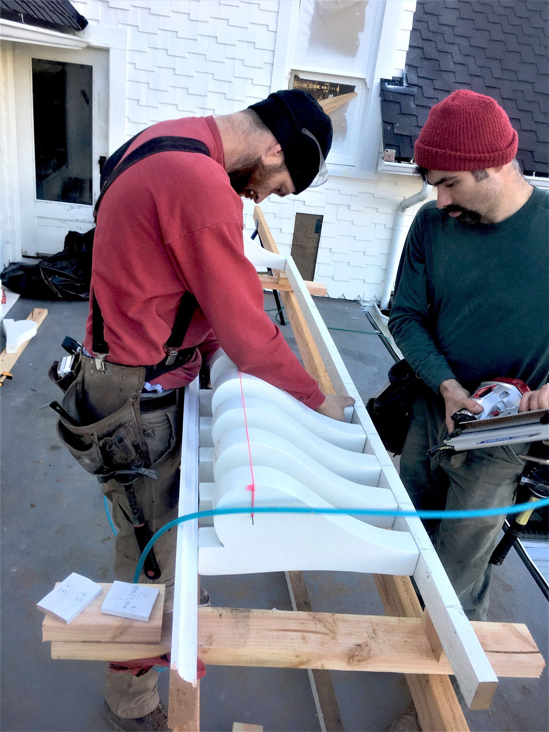 Our team rebuilding exterior railings, using as many original pieces as possible.