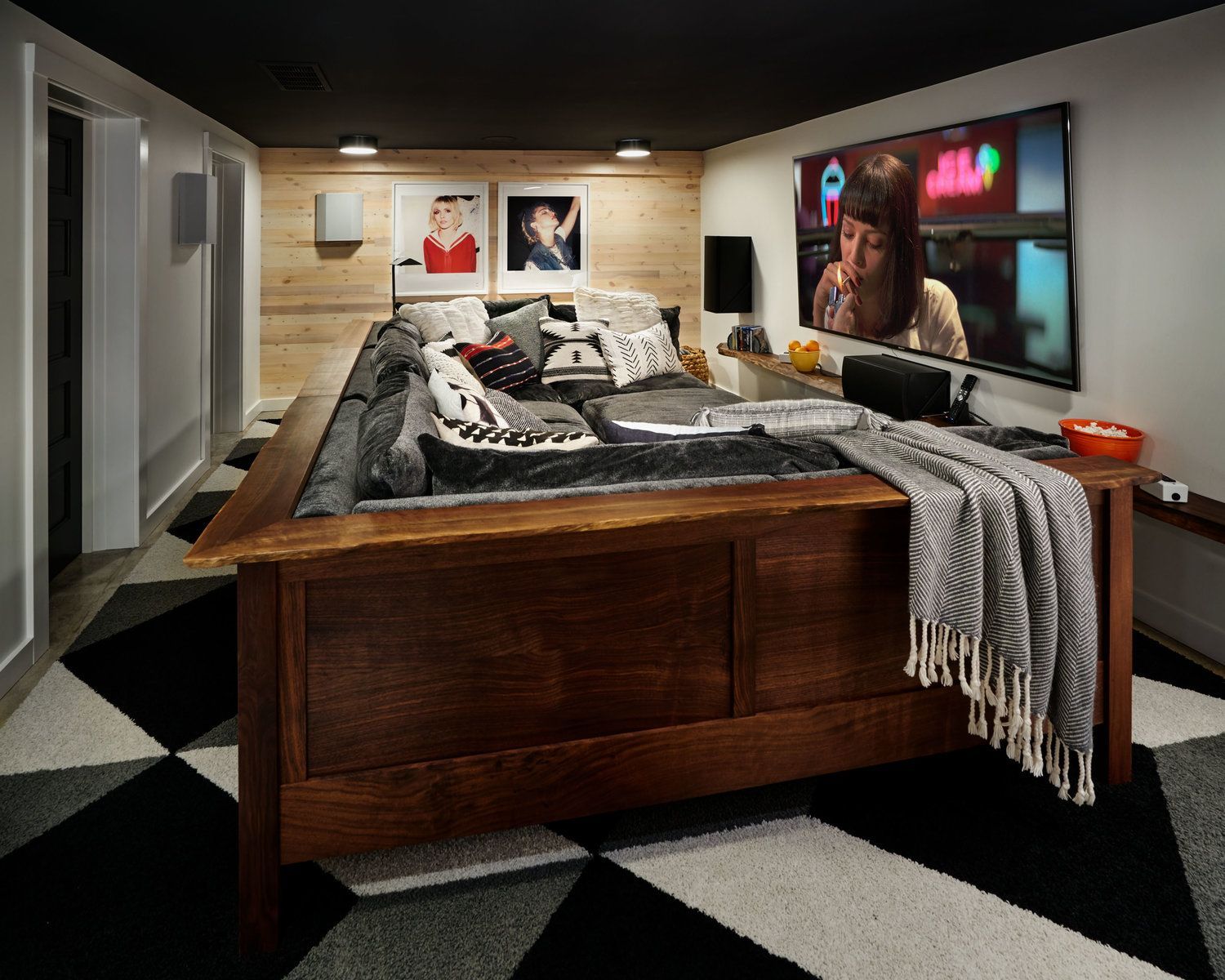 Behind rolling doors, a roomy sectional provides comfy space for napping or watching movie marathons.