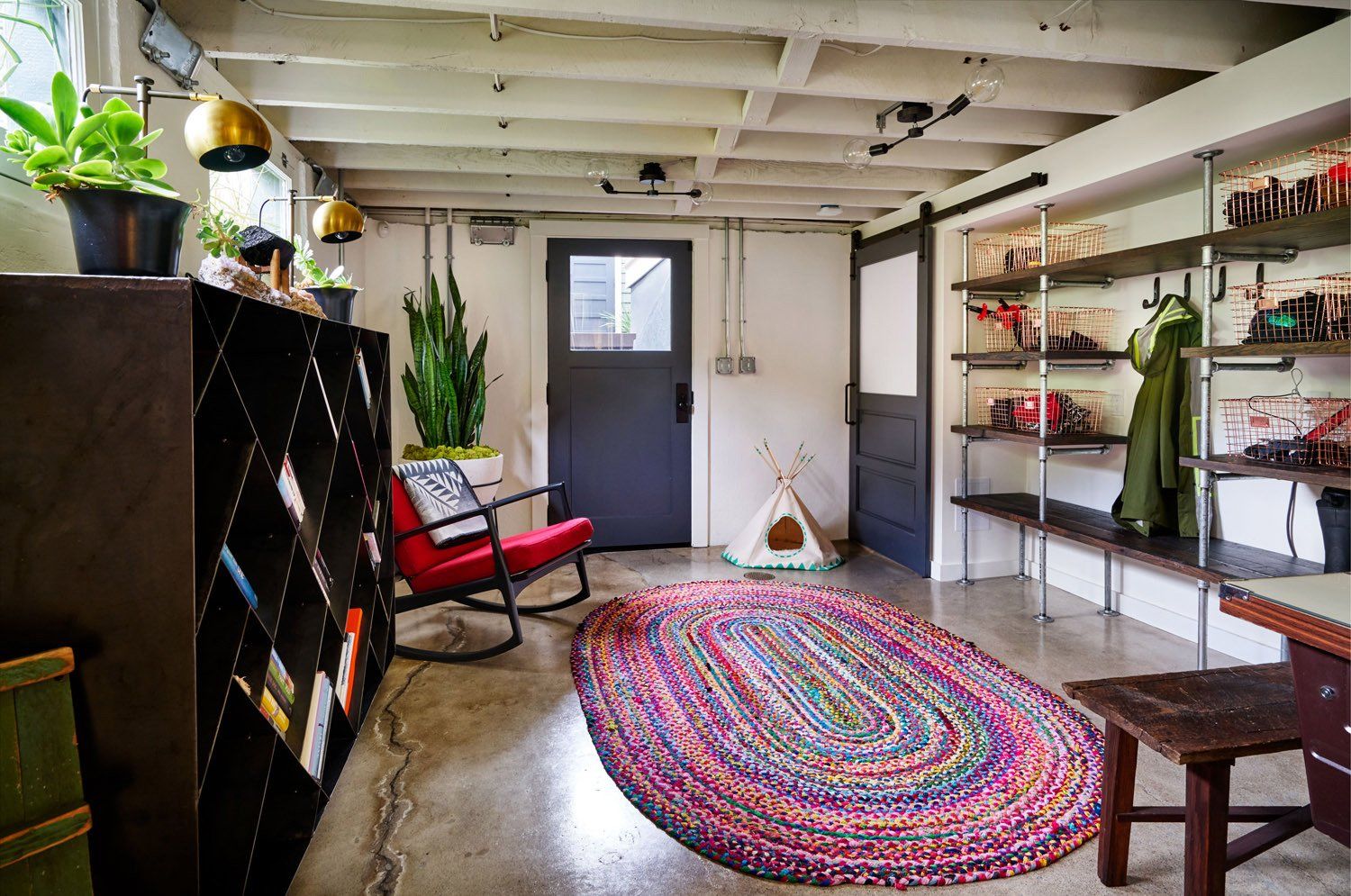 The entire basement was remodeled. Concrete floors were sealed and walls were painted white to maximize light and create a modern-industrial vibe.
