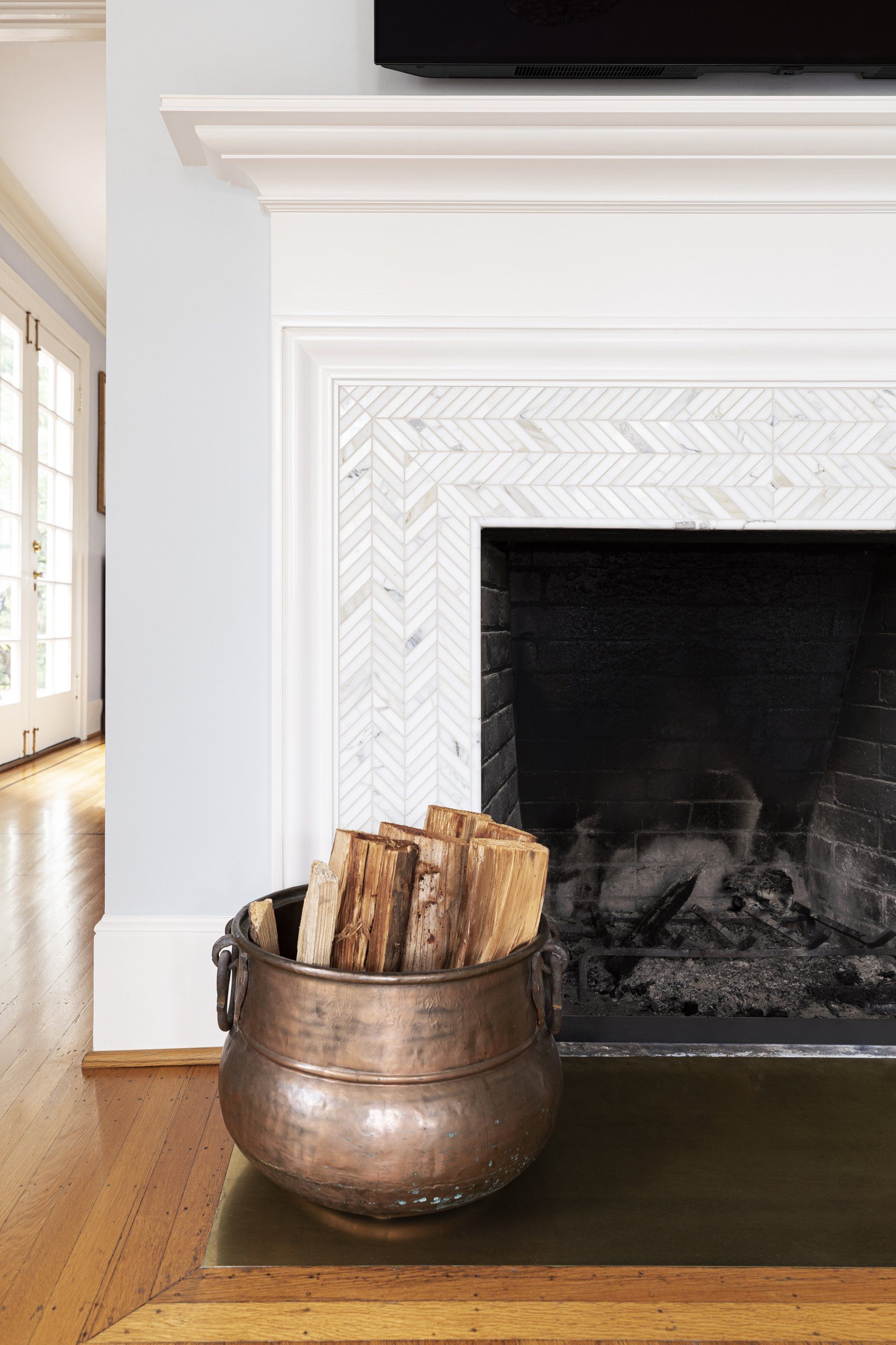 Close up view of the family room fireplace, freshly-tiled.