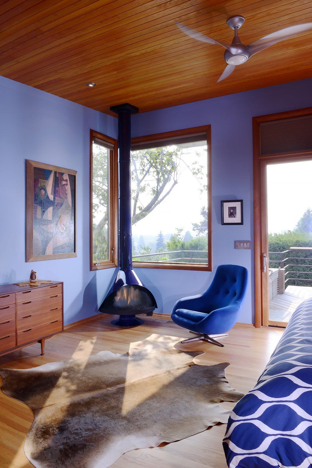 The main bedroom has city views, custom built-ins & a MALM Gas Zircon fireplace.