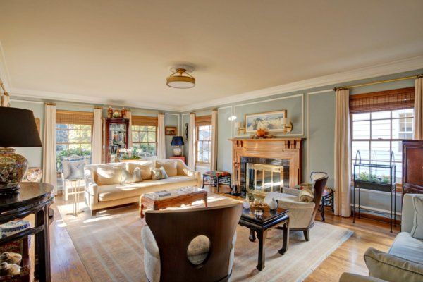 A living room filled with furniture and a fireplace