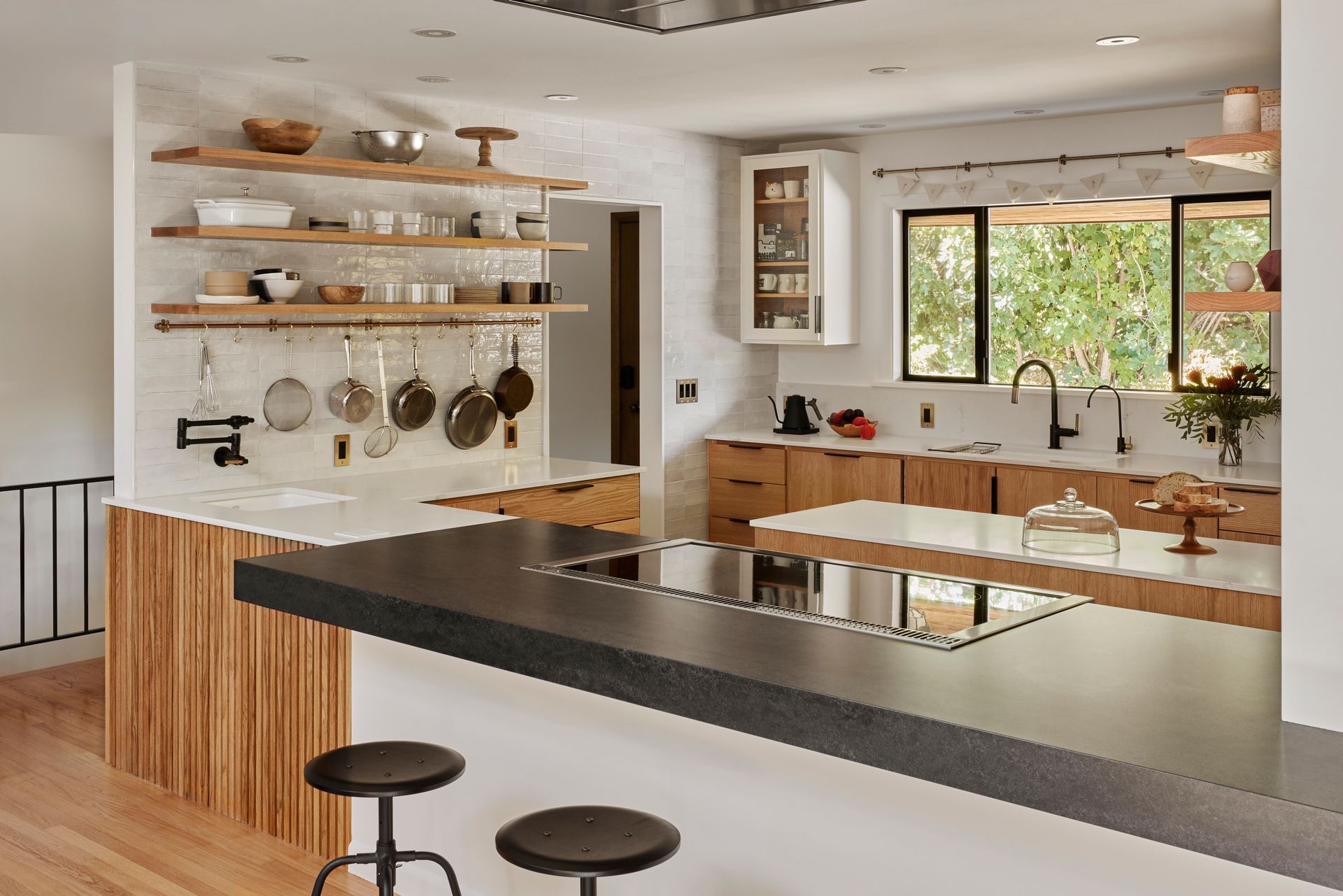 After removing the wall between the living room and kitchen, the newly remodeled space is flooded with light from both sides, making it bright a cheerful all day long. 