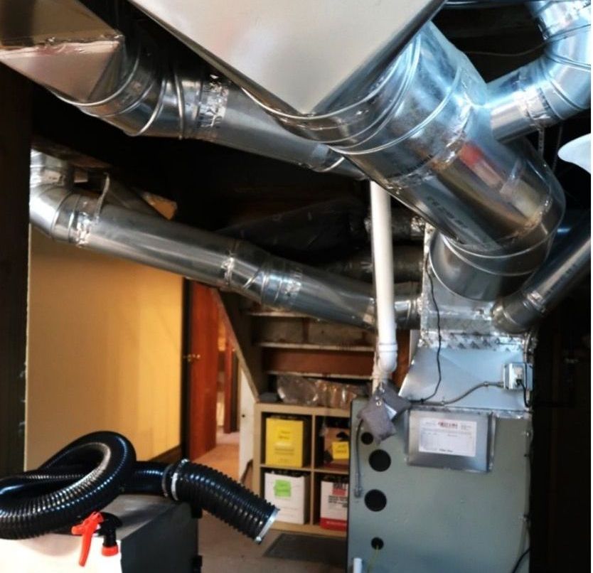 A room with a lot of pipes coming out of the ceiling