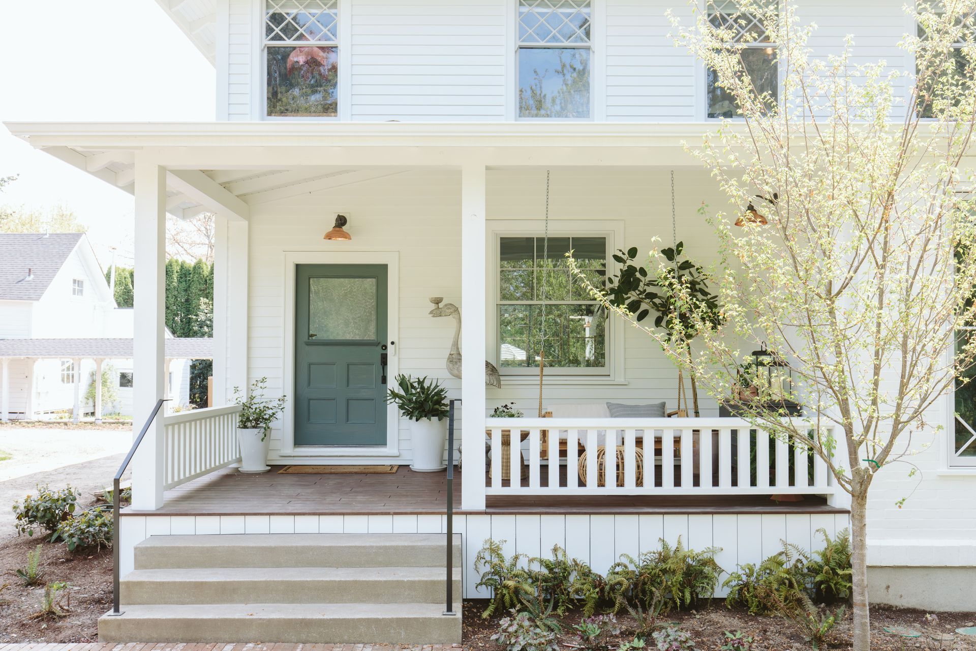 As part of the complete transformation of this SW Portland farmhouse, Arciform added a charming, period-appropriate porch to the front. 