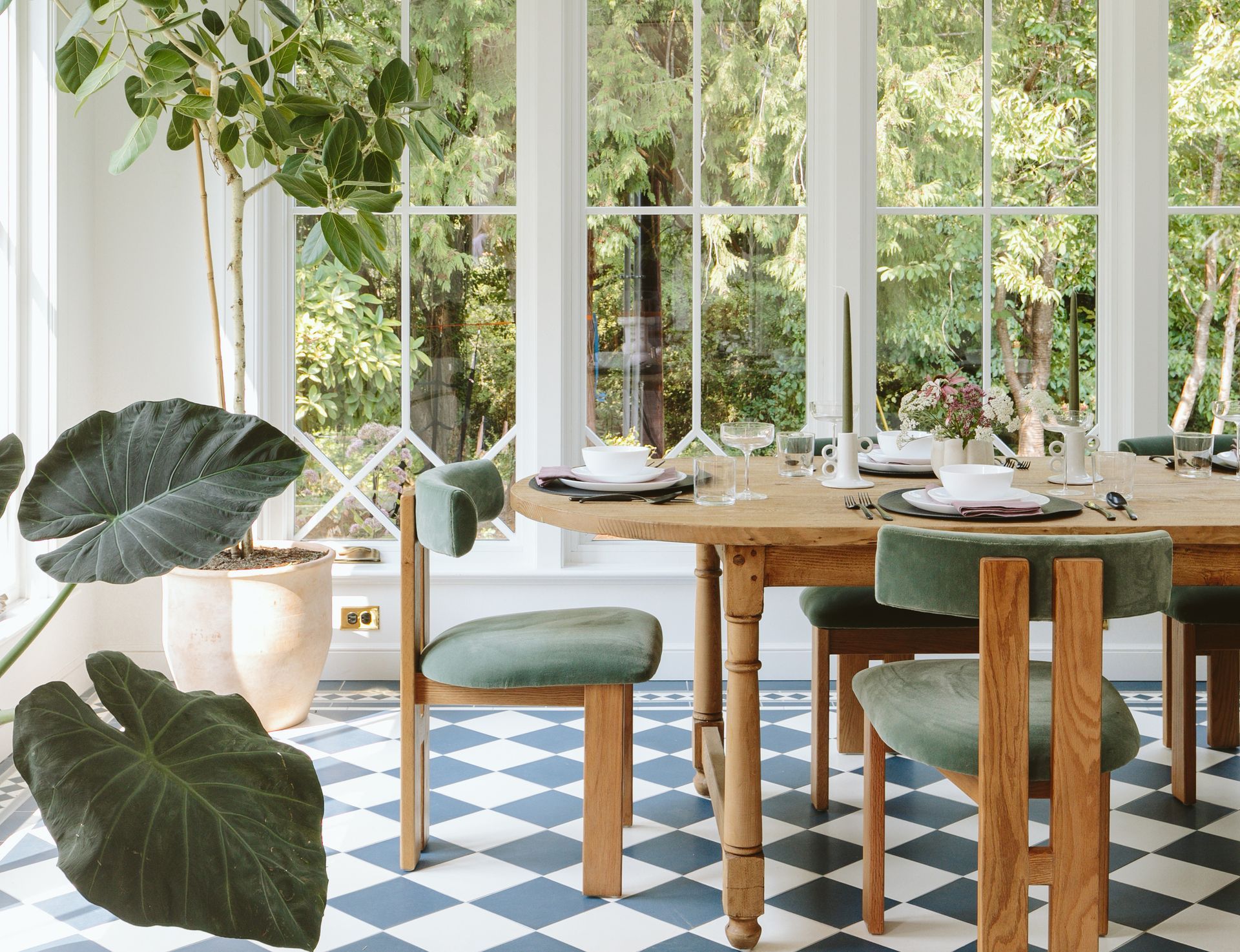 Flooded with light from huge windows and skylights, the sunroom is now the home's main dining area. 