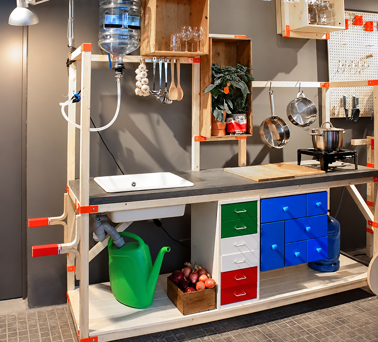 A little ingenuity can go a long way. This homeowner created a temporary basement kitchen with running water, a sink, prep space, and a portable cooktop to keep meals and daily routines running smoothly.