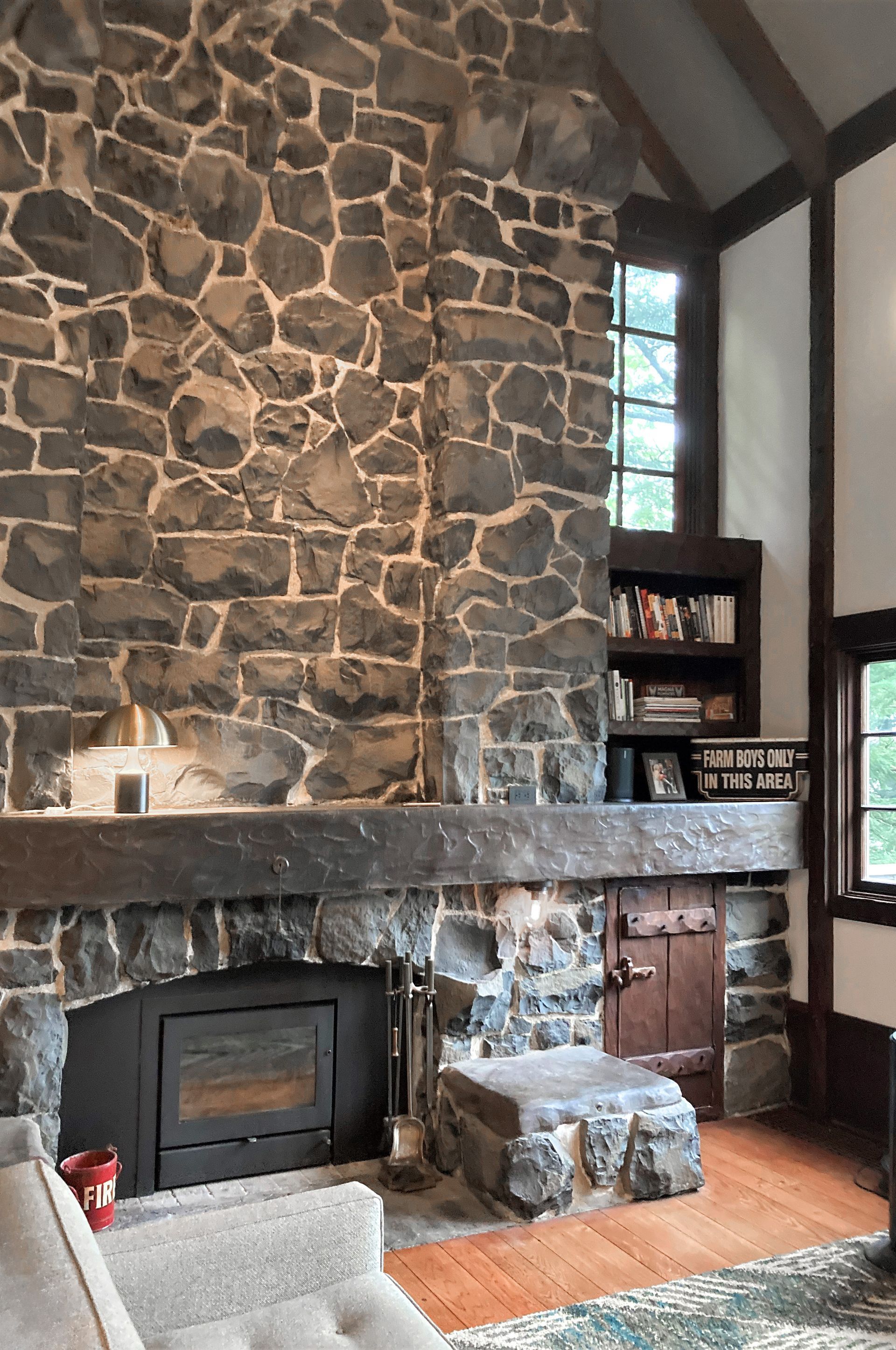 Close up of the original stone fireplace in the living room.