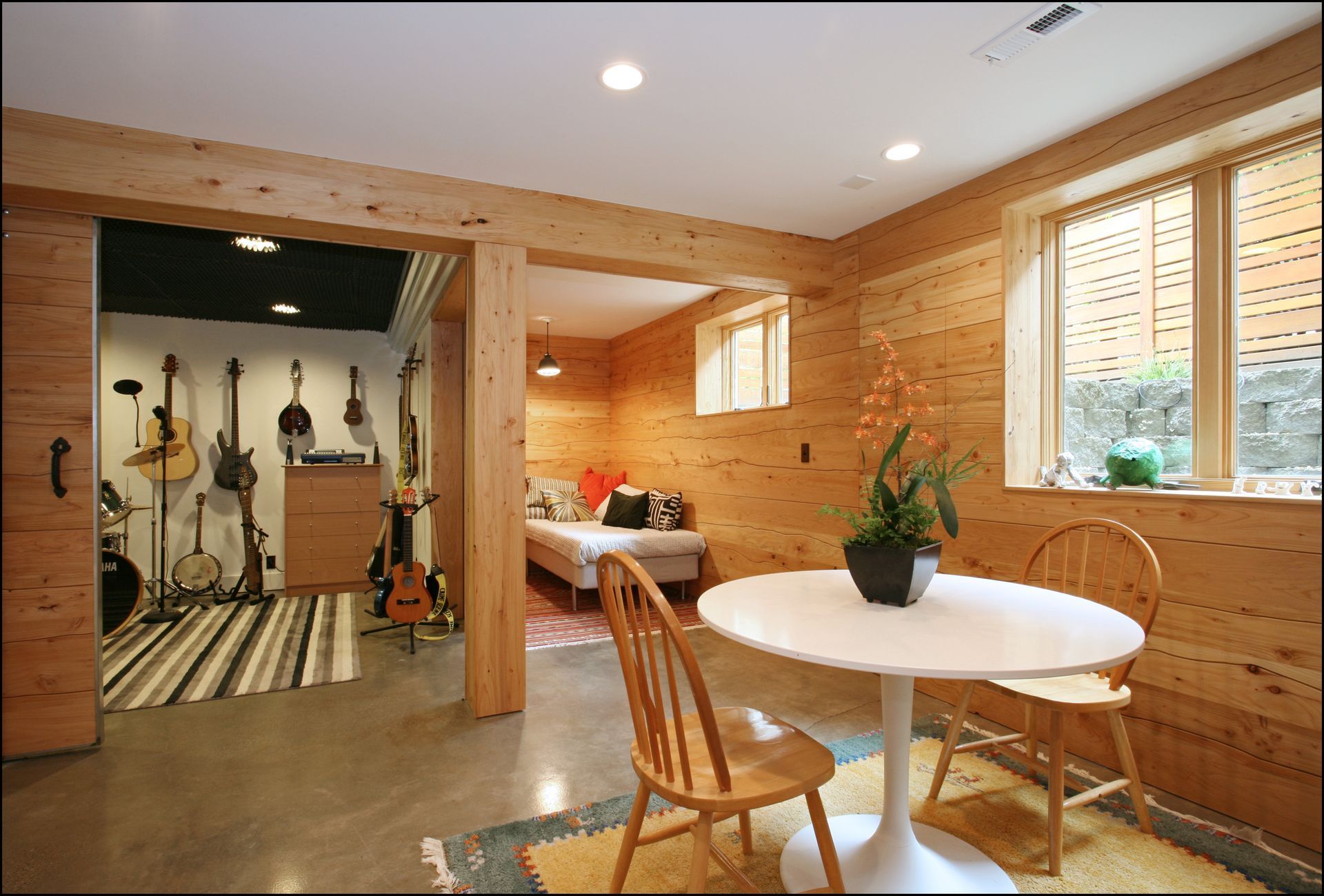 From the game table in the family room, you can see the napping corne with a cozy bed under the natural light of a window