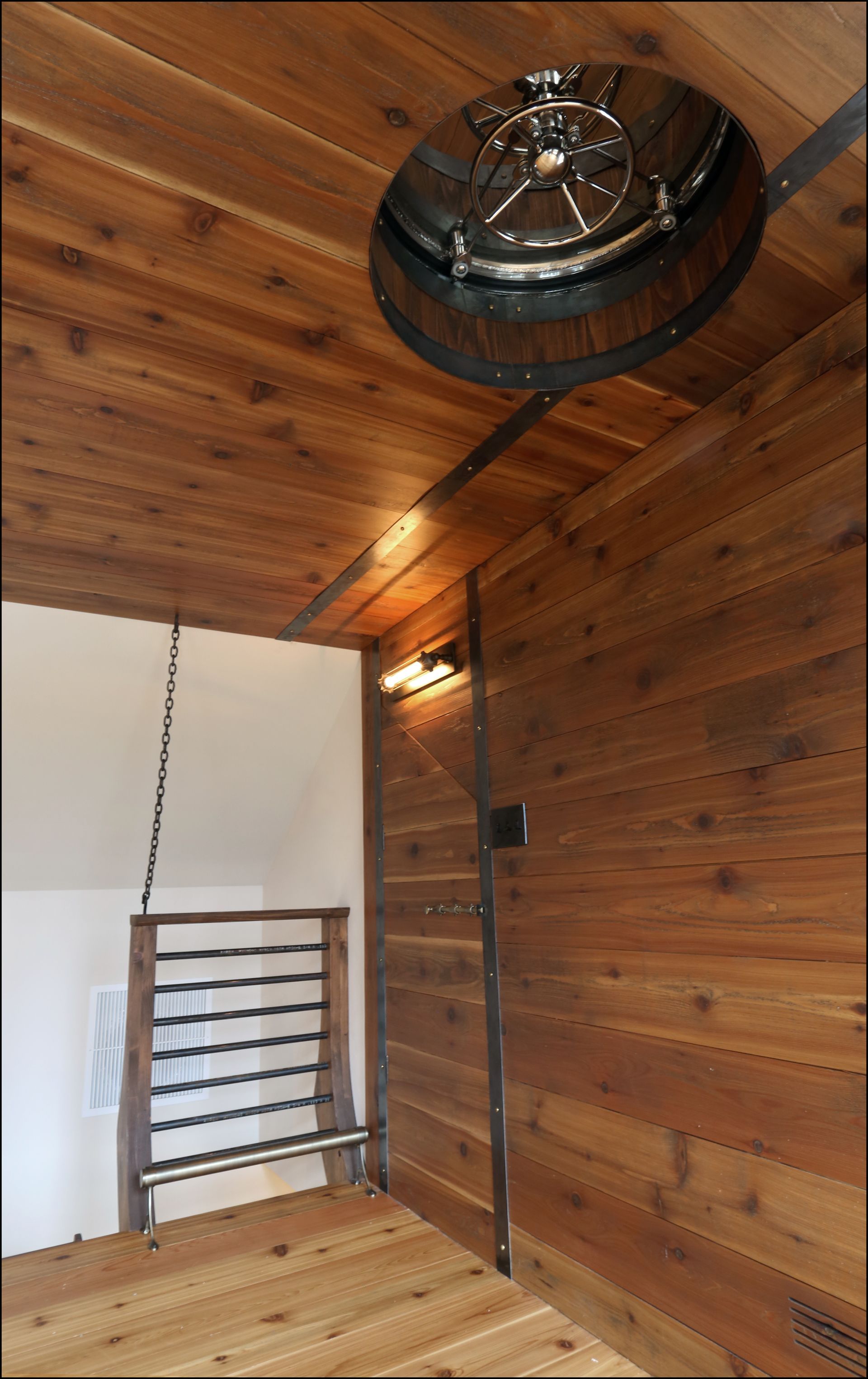 There is also a submarine hatch on the ceiling and a ladder up to a widow's walk on the roof