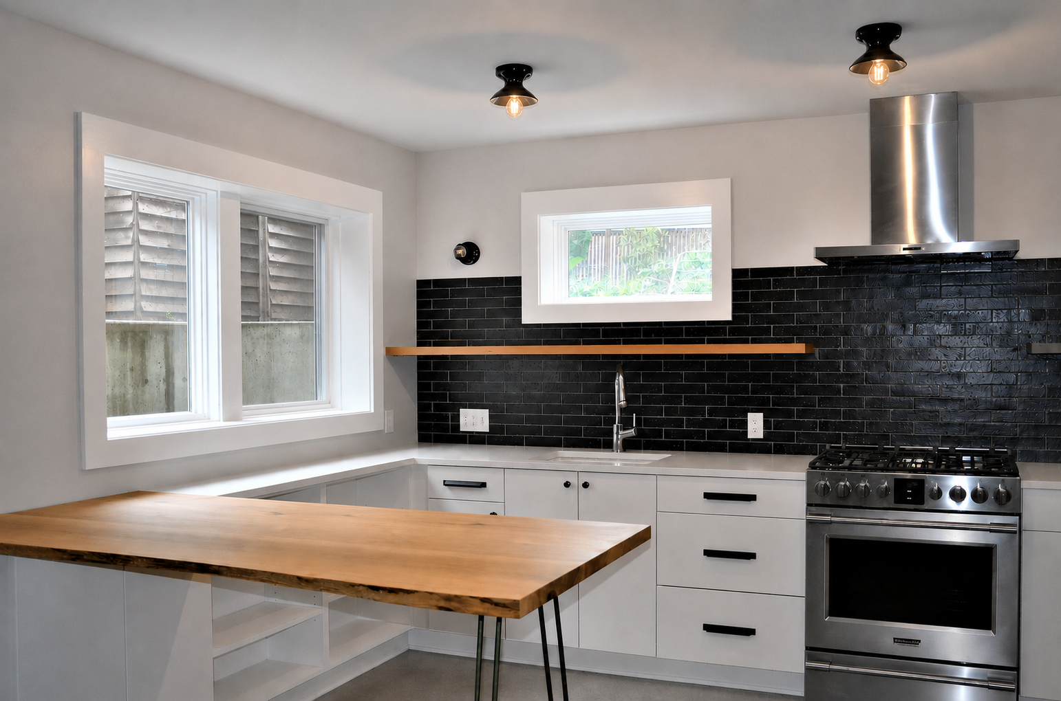 A kitchen with white cabinets , stainless steel appliances and a wooden counter top.