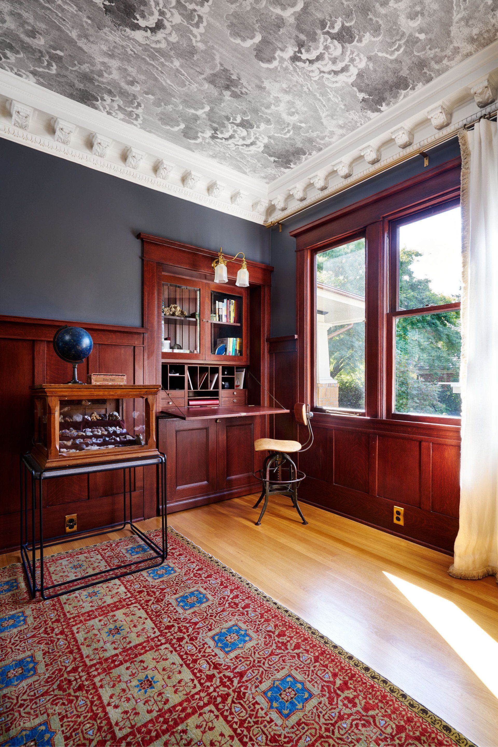The pull-out guest bed was restored to function as it had originally. Here it is pushed into its wall cavity and appears to be a built-in desk.
