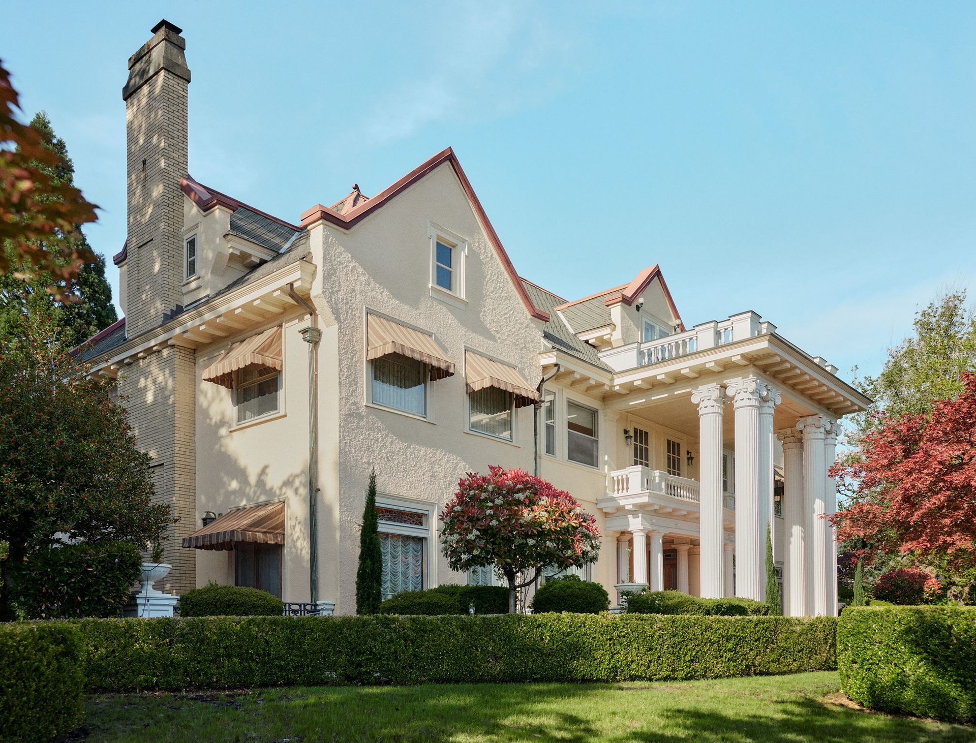The grand facade of the Barnes Mansion, high above hilly Klickitat Street. 