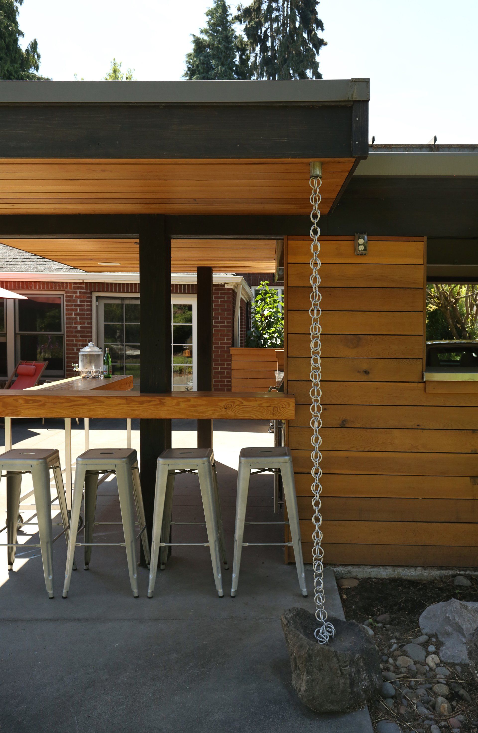 View of the outdoor kitchen with stools