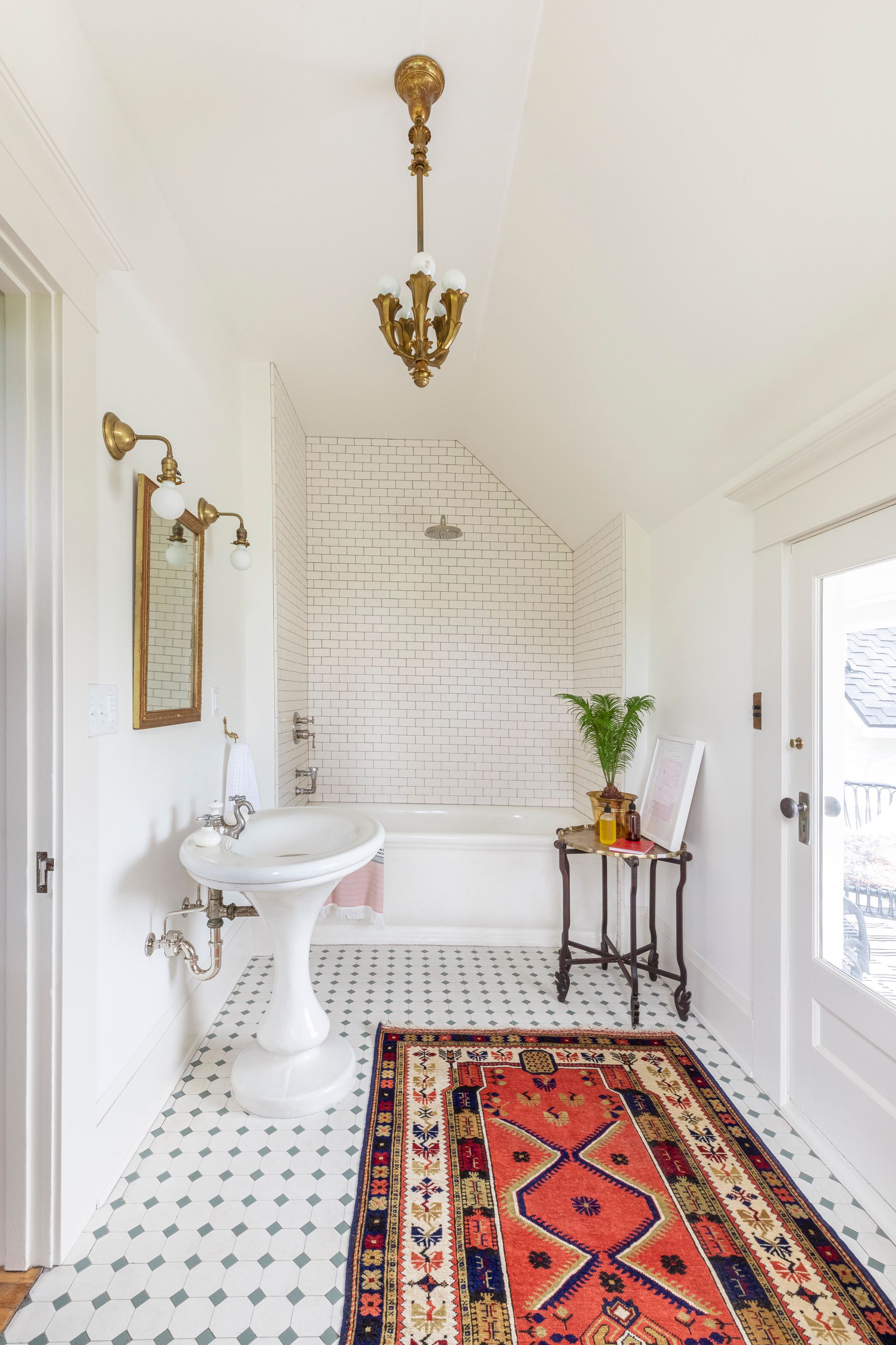 An original 2nd floor bath with classic white tile.