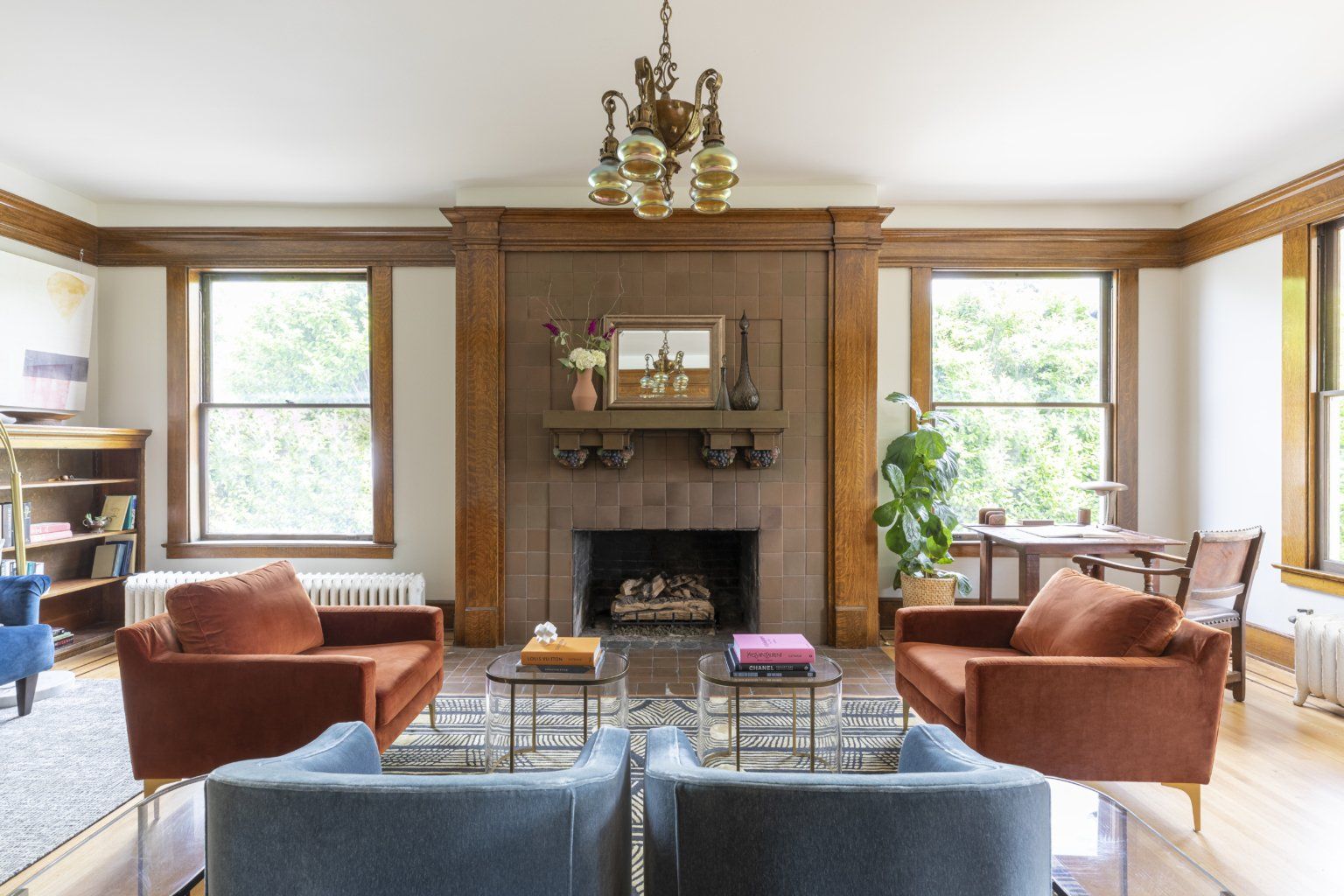 The living room fireplace can be enjoyed from comfortable upholstered seating.