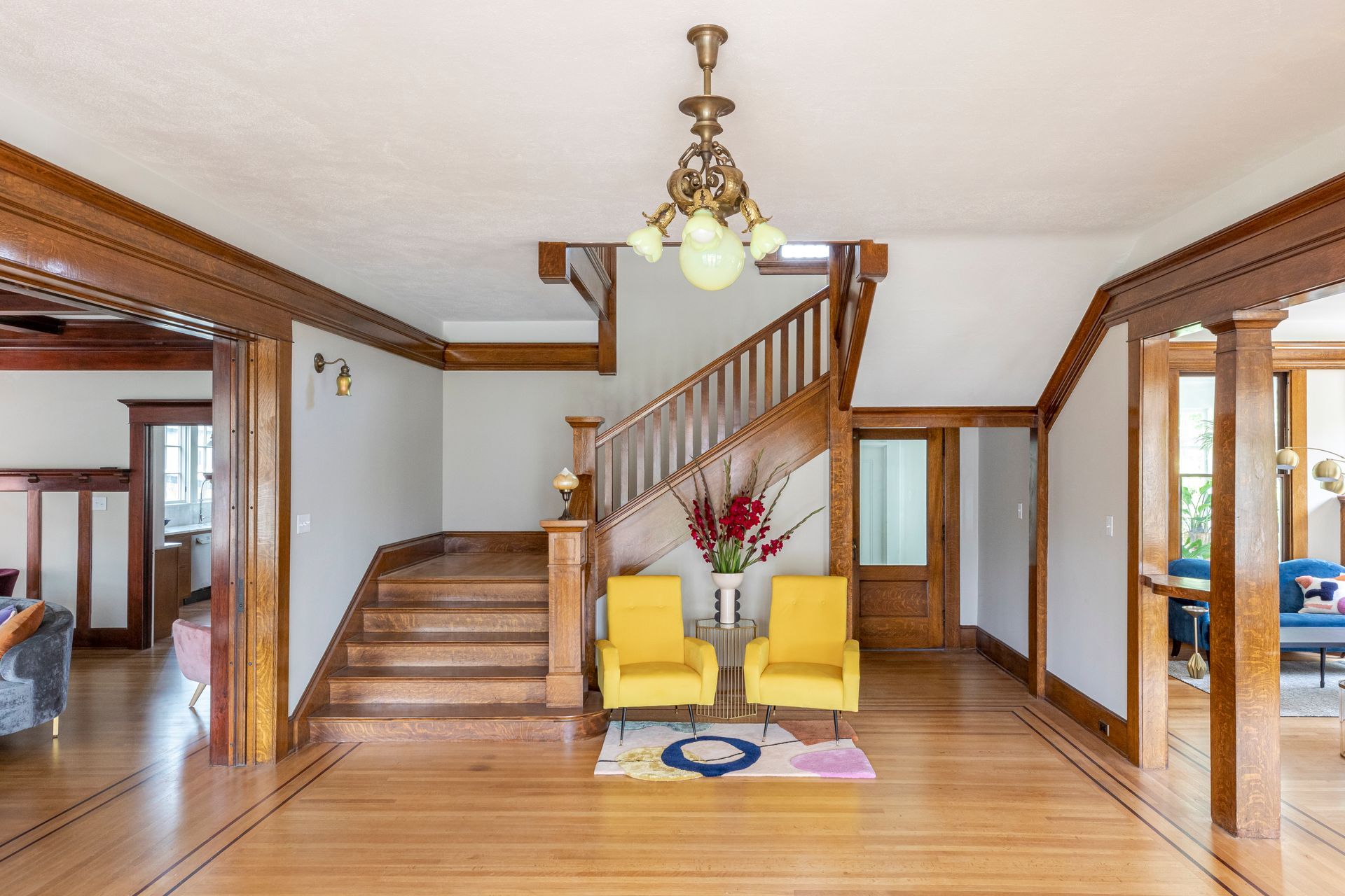The original main staircase in rich stained wood was restored.