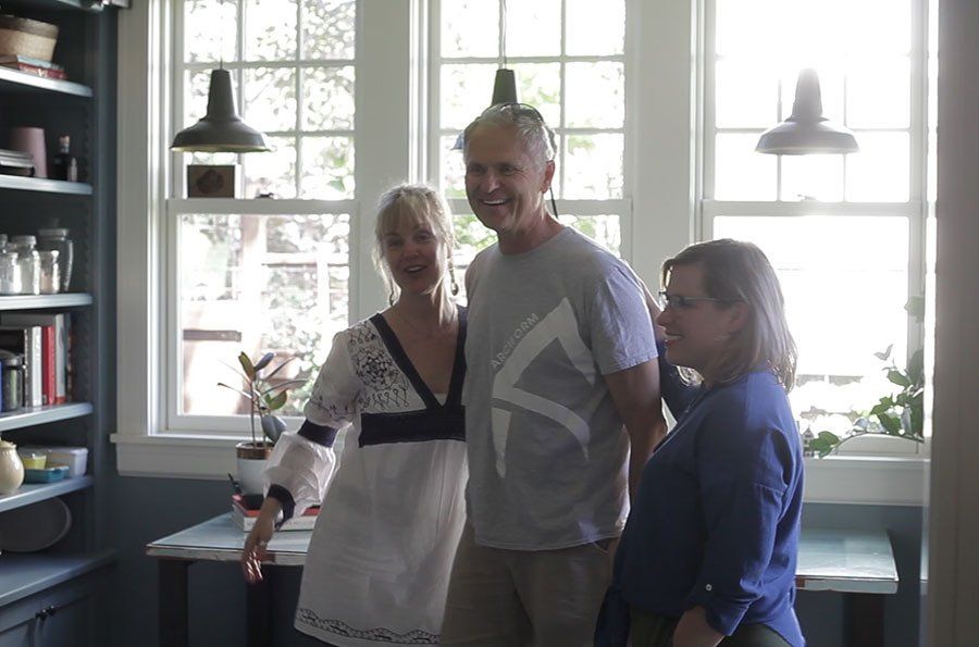 Anne, Roger and Kerri playfully smile for all the cameras in the mudroom.