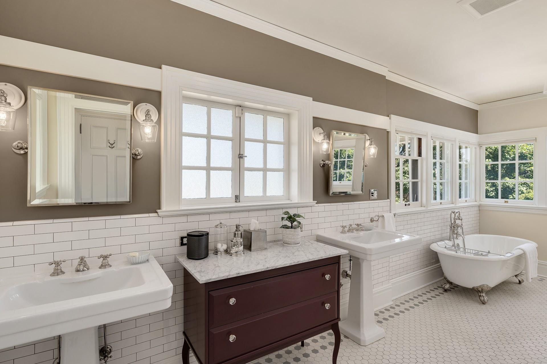 1916 Irvington Colonial Revival primary bathroom with pedestal sinks