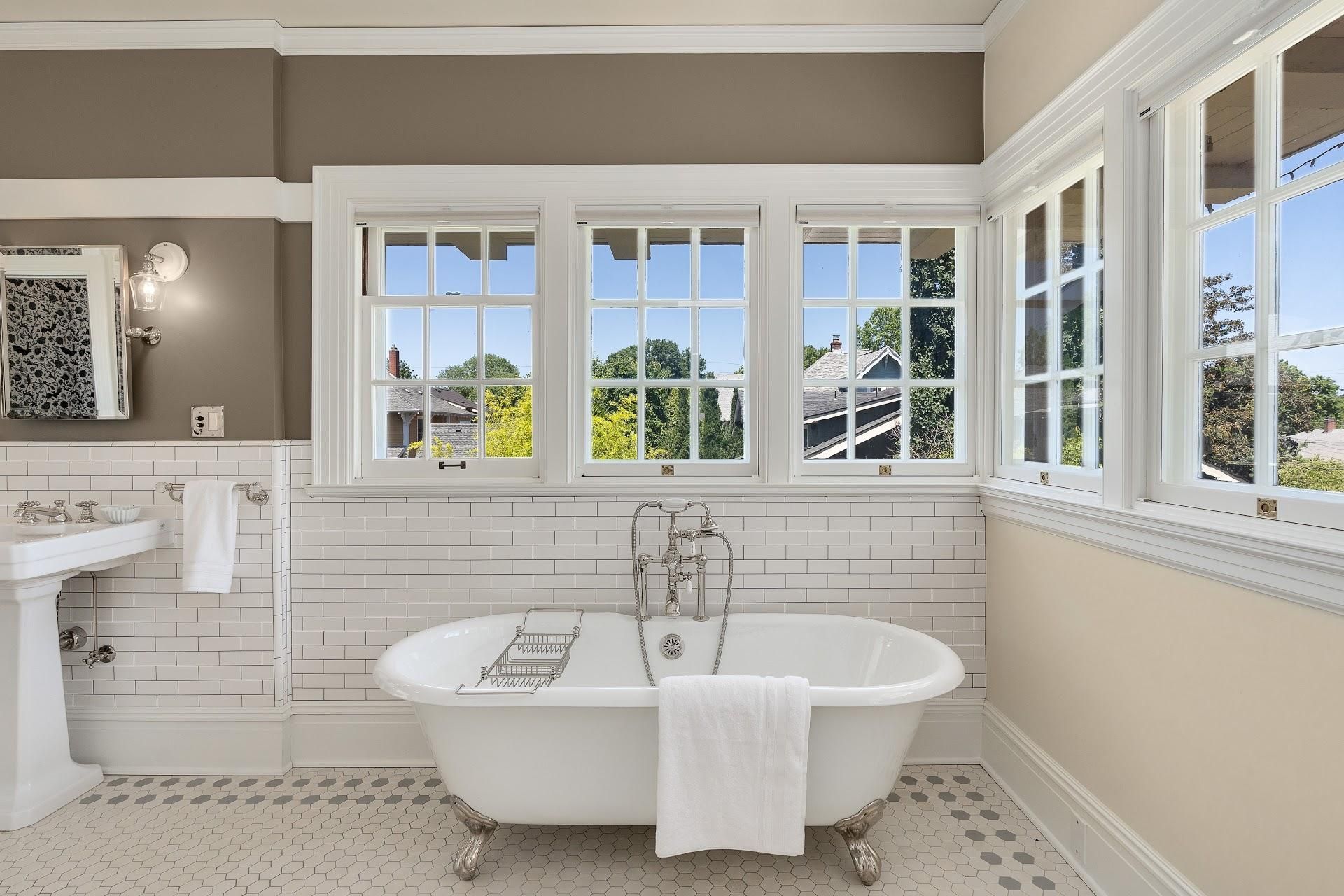 1916 Irvington Colonial Revival primary bathroom with clawfoot tub