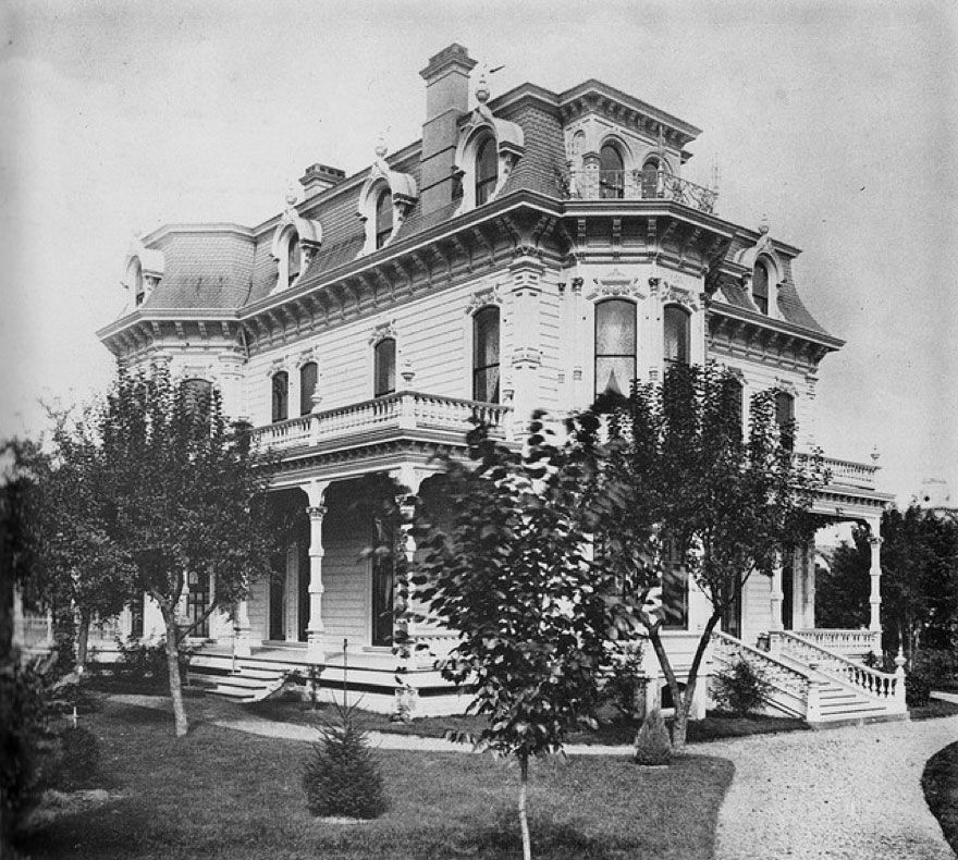 A black and white photo of a large house