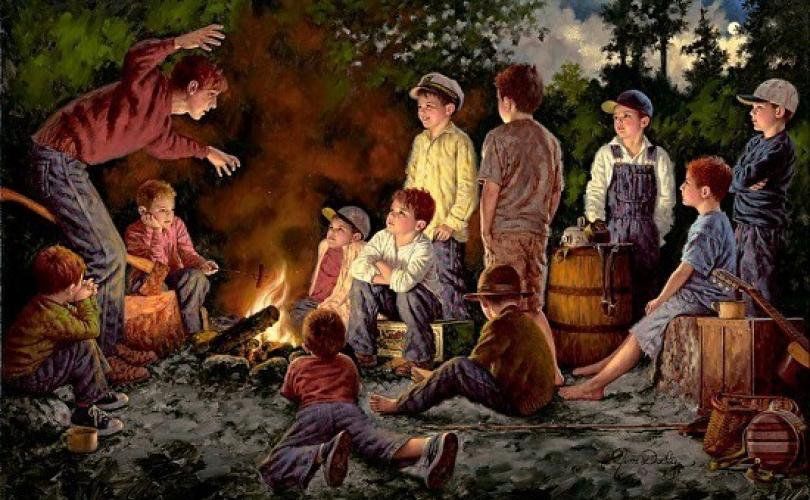 A group of children are sitting around a campfire.