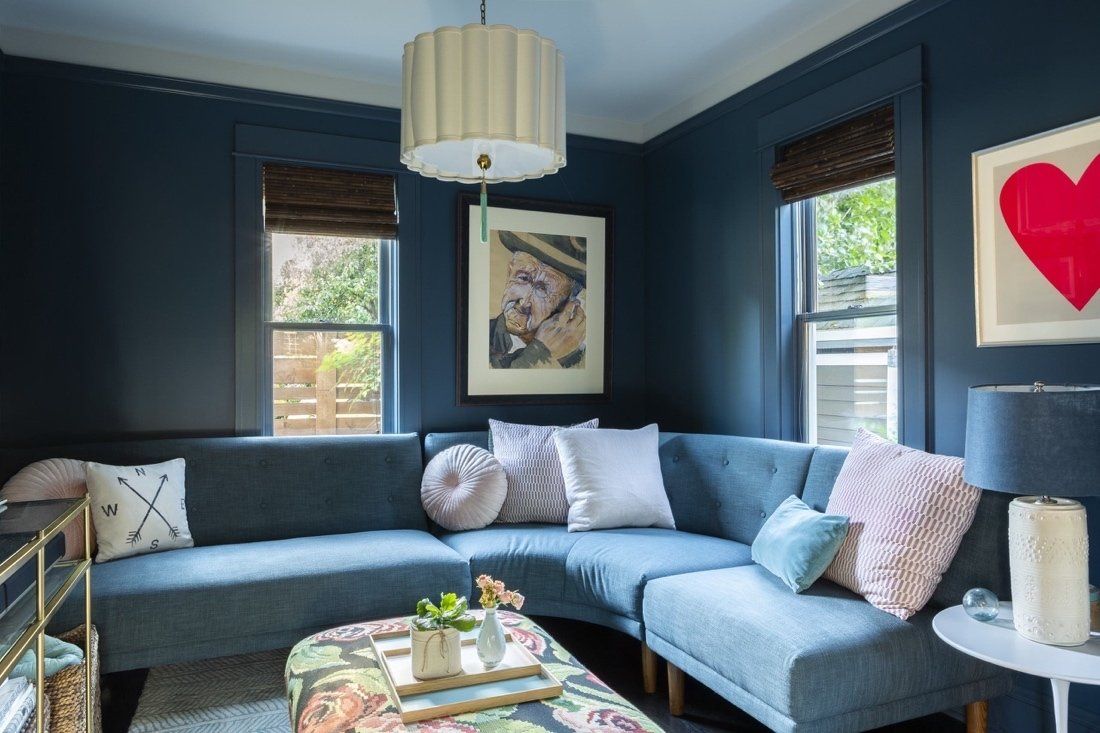 The living room in Kerri’s house features her father’s artwork.
