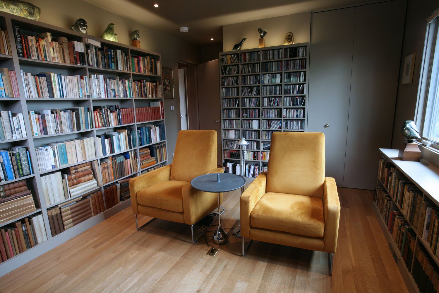 At the front of the house is a bedroom transformed into a media room and library.