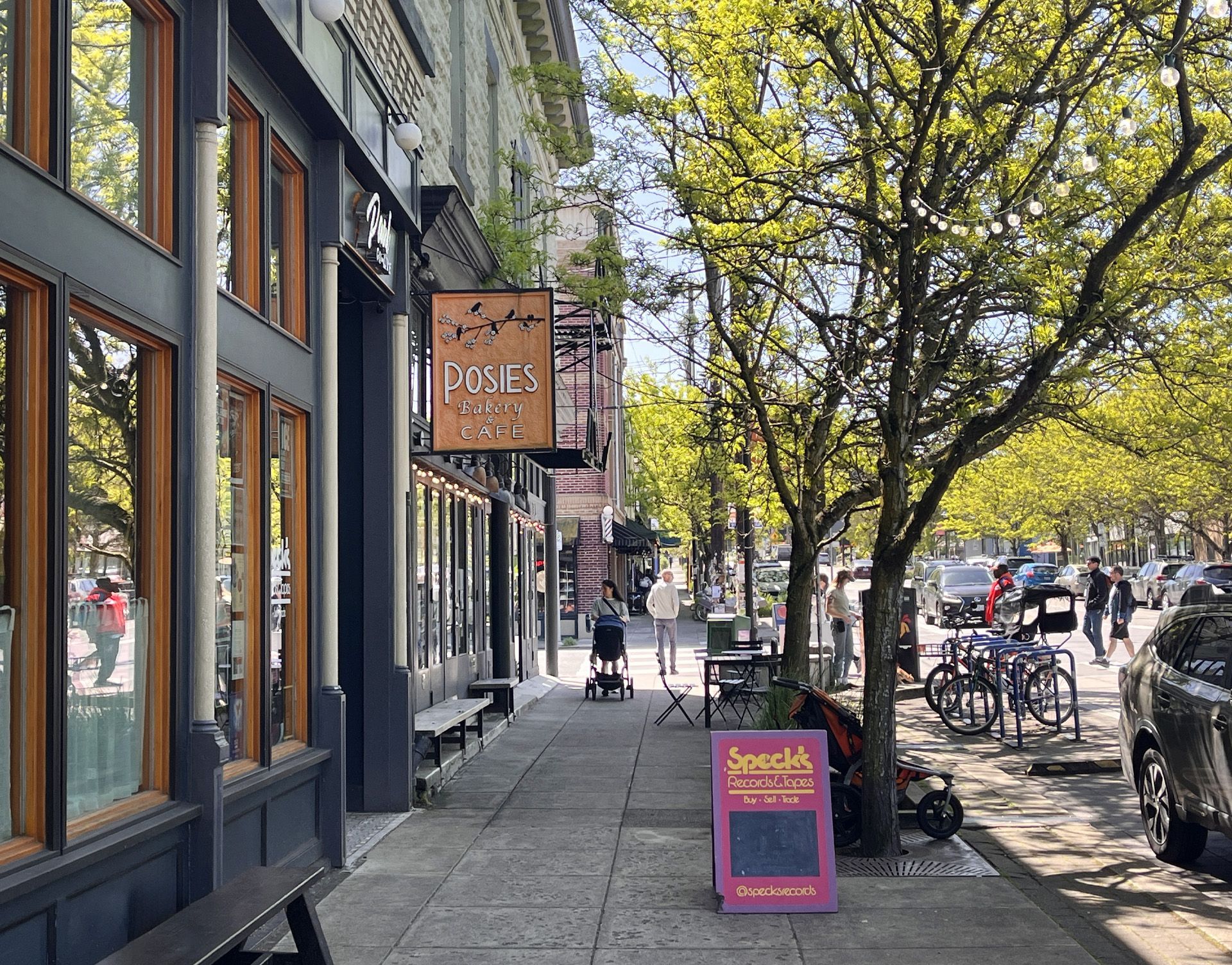 Denver Avenue on a sunny spring afternoon is alive with activity. 