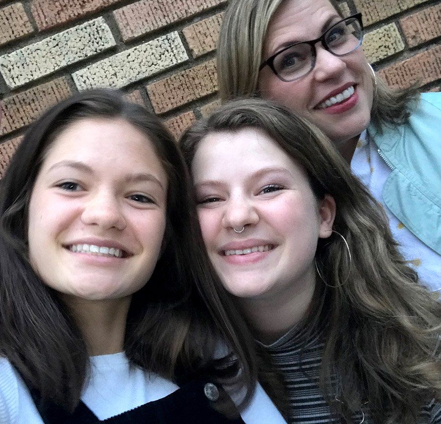 Kerri with her two daughters, who are now just on the edge of adulthood.