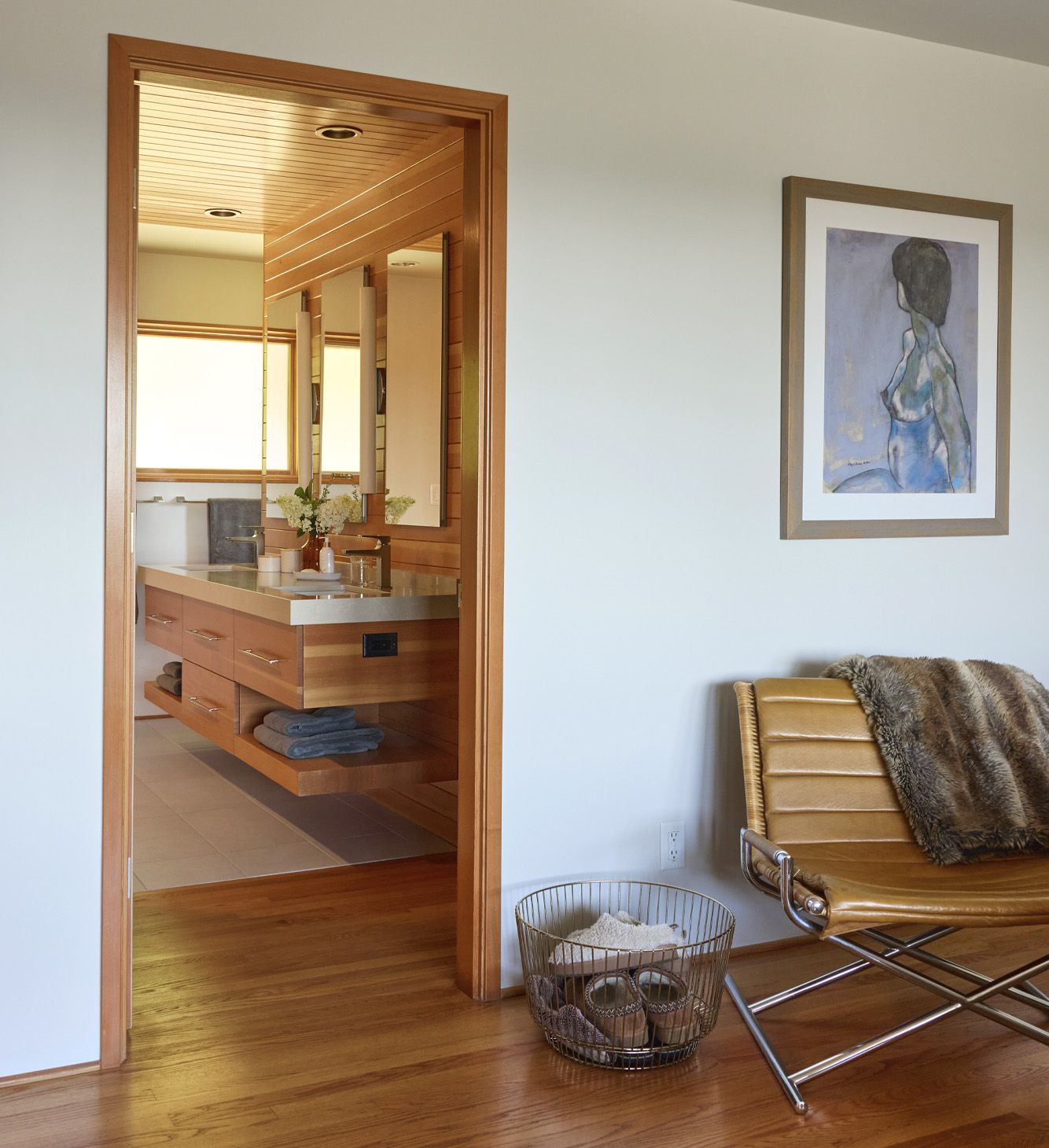 From the main bedroom, view of the floating vanity in the new main bath.