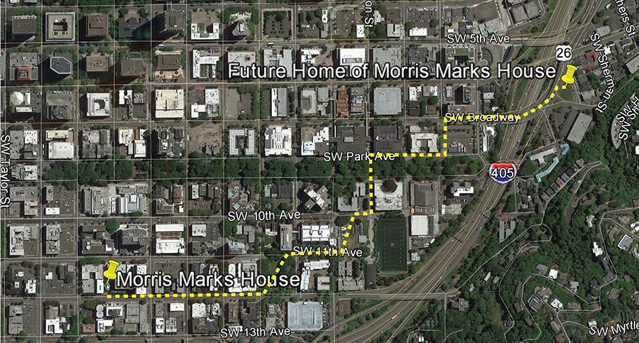 Aerial map with yellow route and labels marking Marcus Garvey House and another labeled location near a highway.