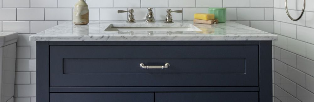 Painted vanity in remodeled bathroom.