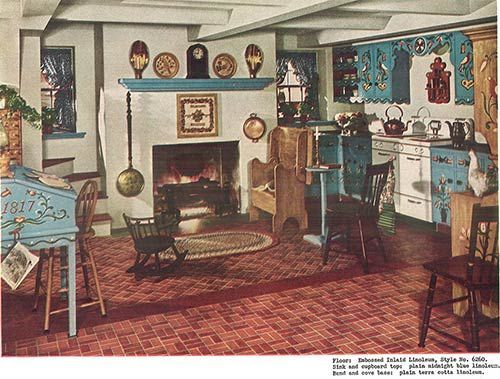Vintage living room with fireplace, patterned rug, blue chairs, and shelves of decorative pottery