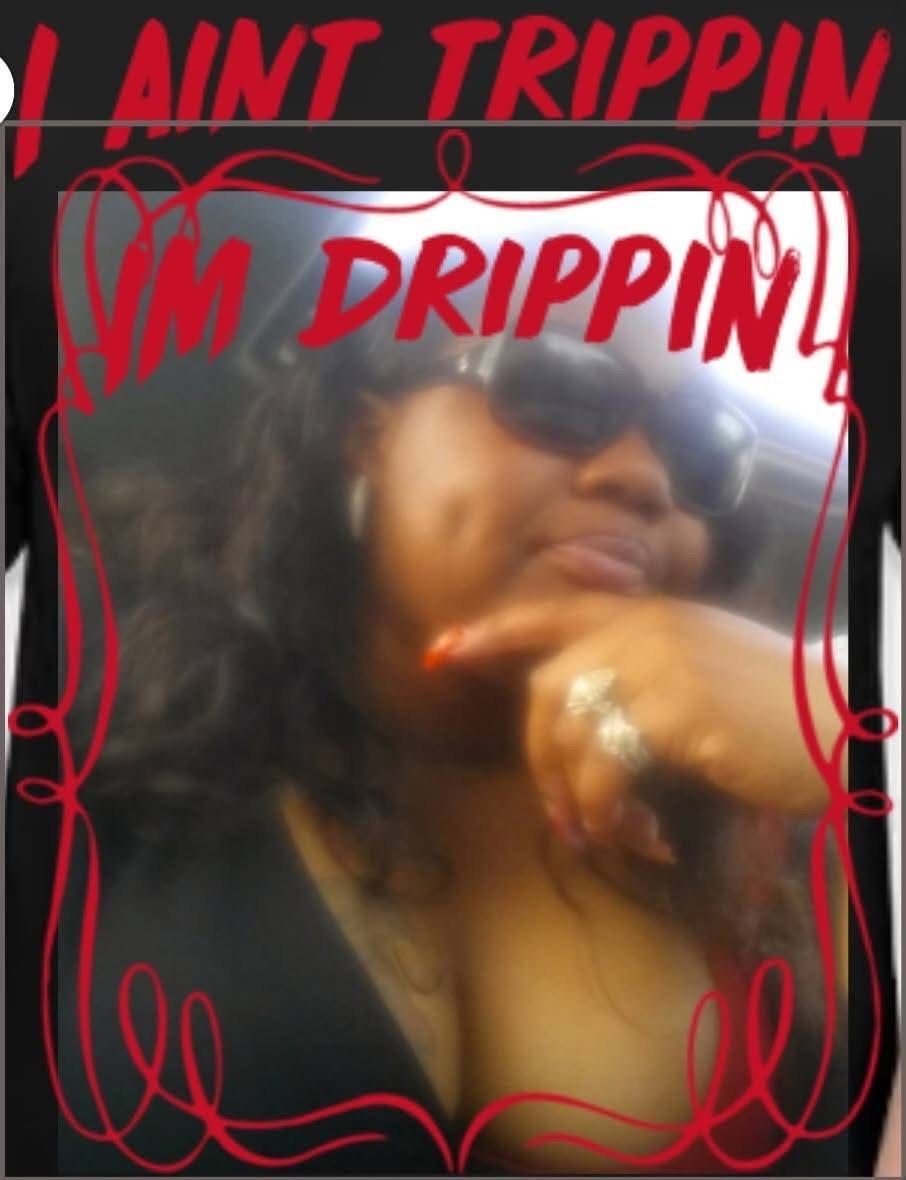Person in sunglasses posing with hand on chin, framed by red doodles and bold text reading “I AIN’T TRIPPIN I’M DRIPPIN.”