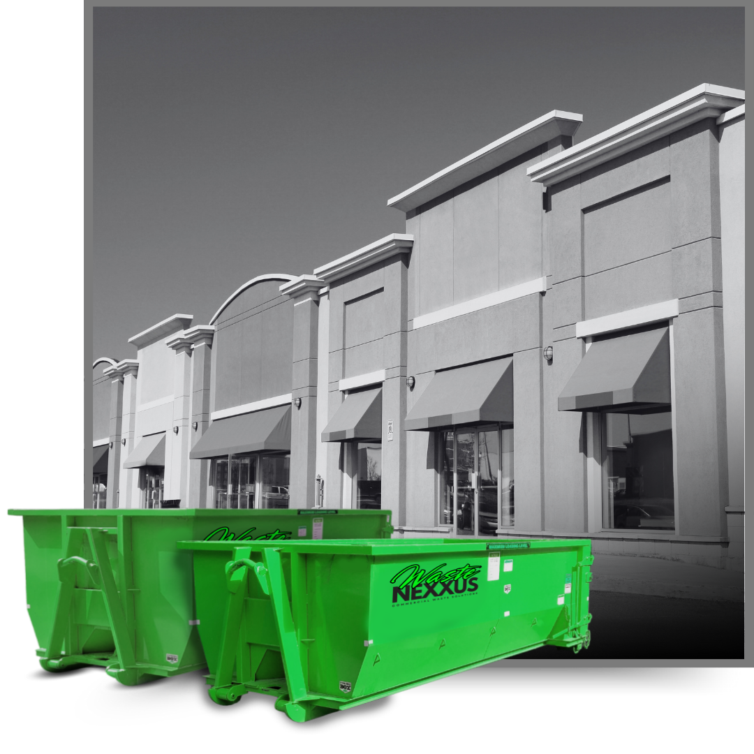 Dumpsters in front of a commercial building