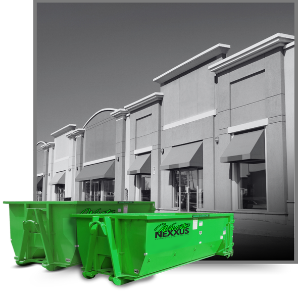 Dumpsters in front of a commercial building