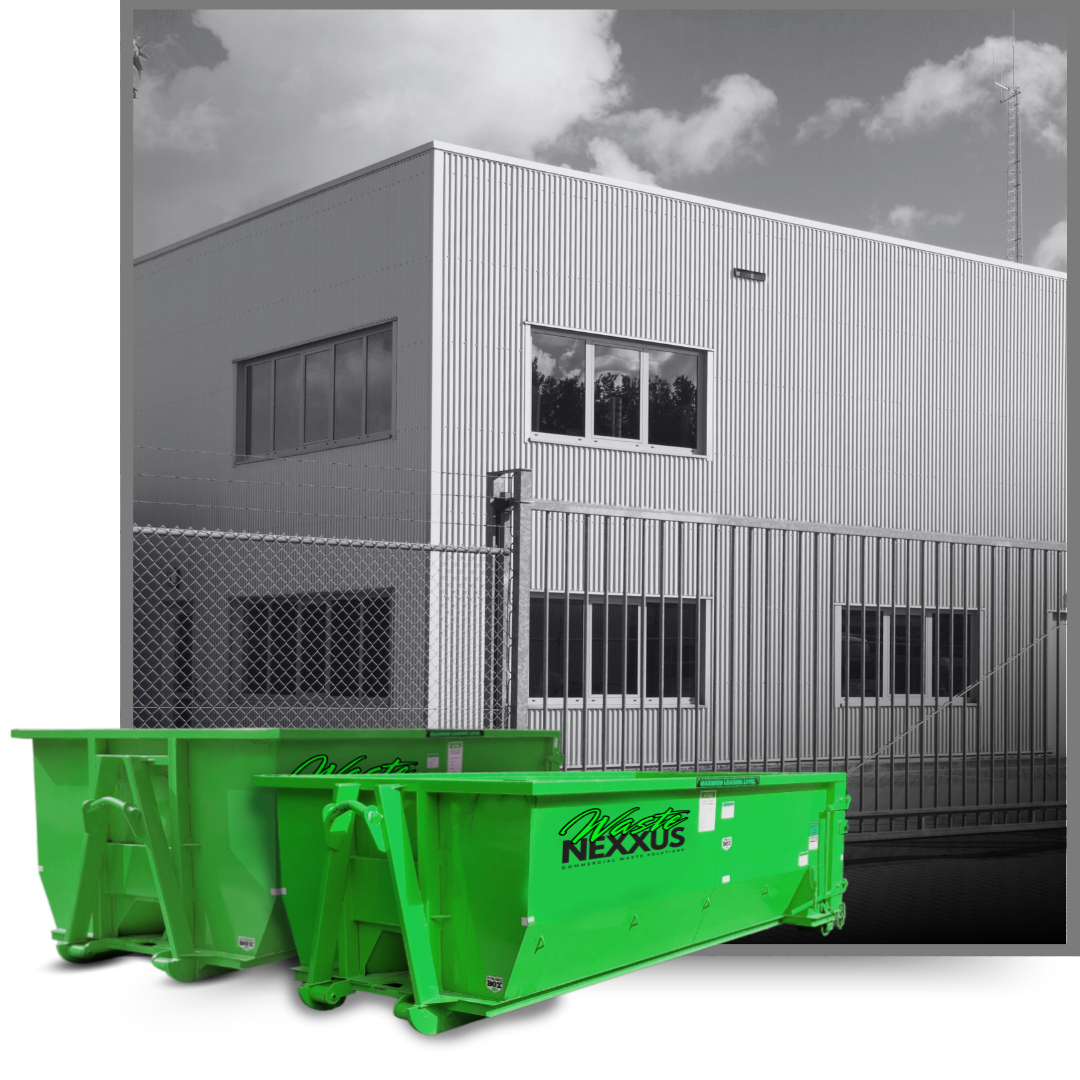 Dumpsters in front of an industrial building