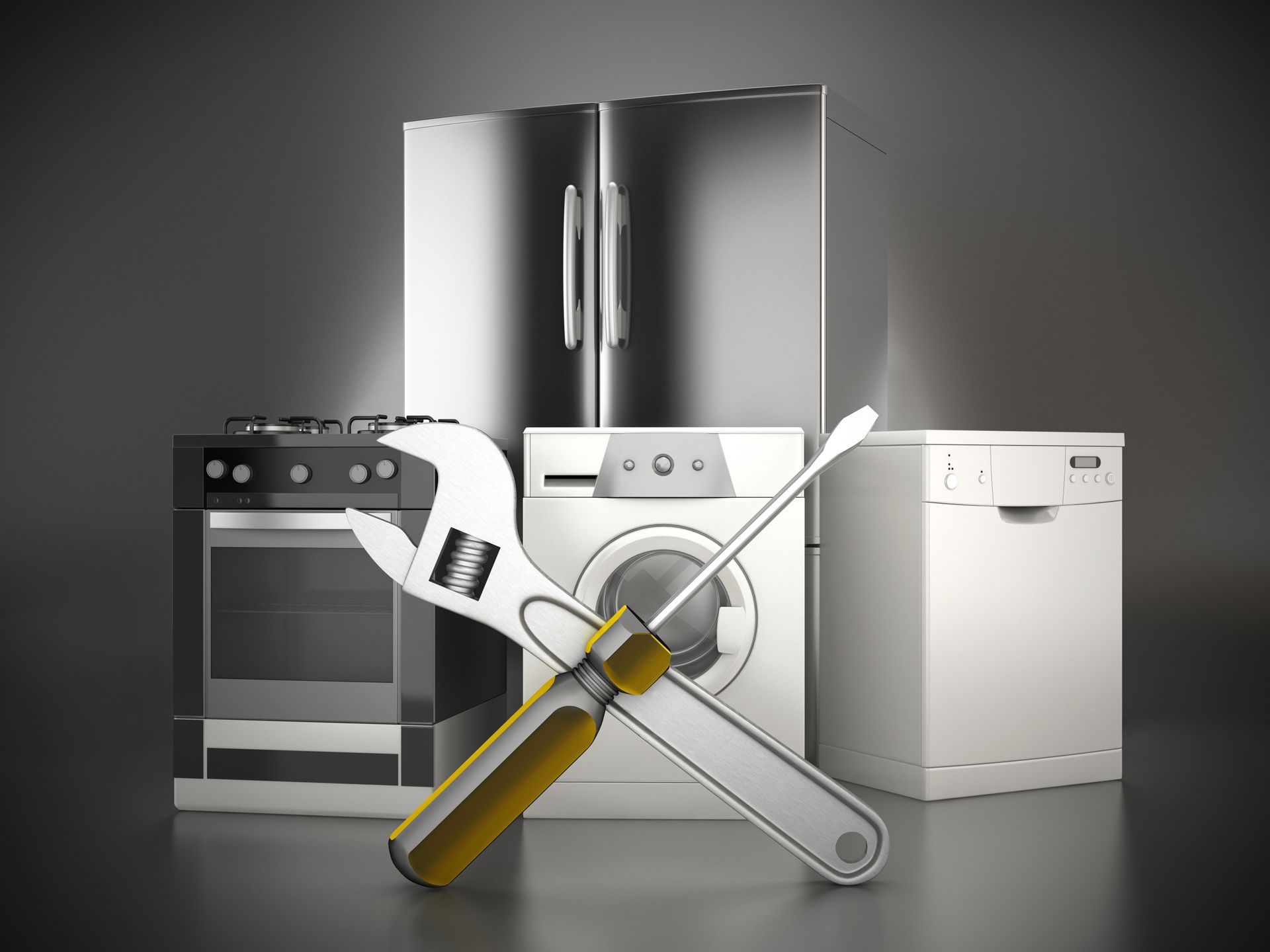 A wrench and a screwdriver are sitting next to a refrigerator , washing machine , and dishwasher.