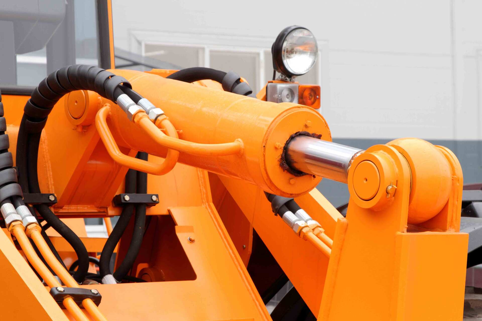 Orange excavator with black hydraulic hose | Port Stephens, NSW | Shire Hoses