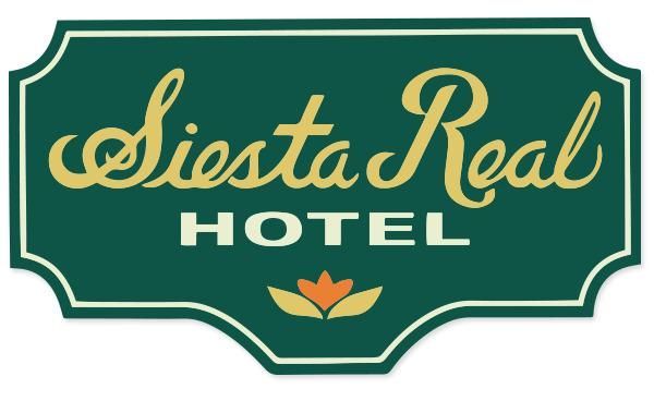 A green sign that says siesta real hotel on it