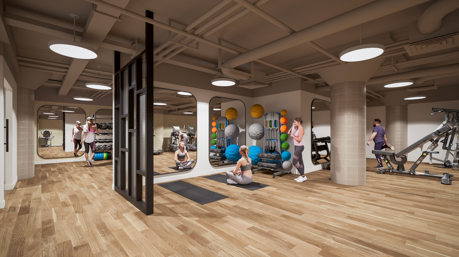 Spacious gym with wood floors, weight machines, and people exercising under round ceiling lights