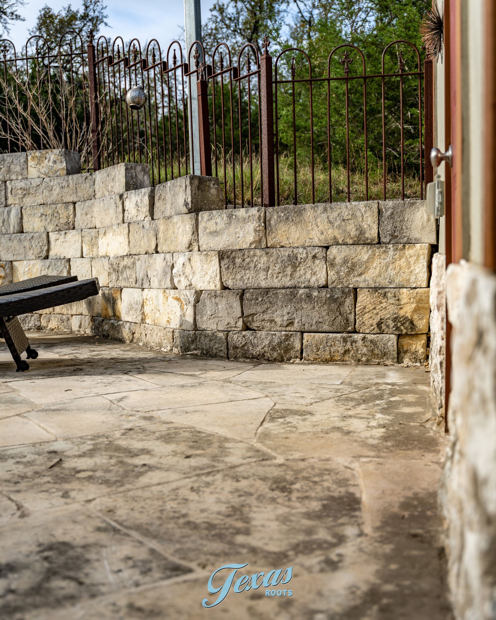 Close-up of black algae staining on limestone home exterior Central Texas
