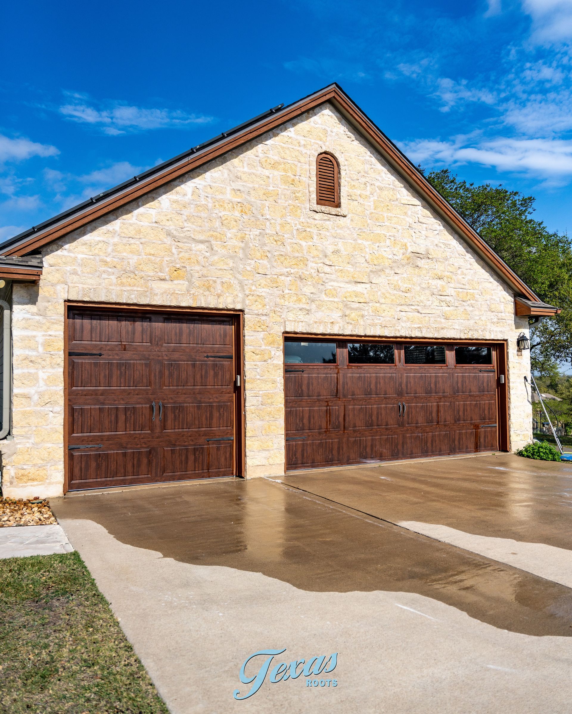 Clean stone home exterior after soft washing in Dripping Springs Texas