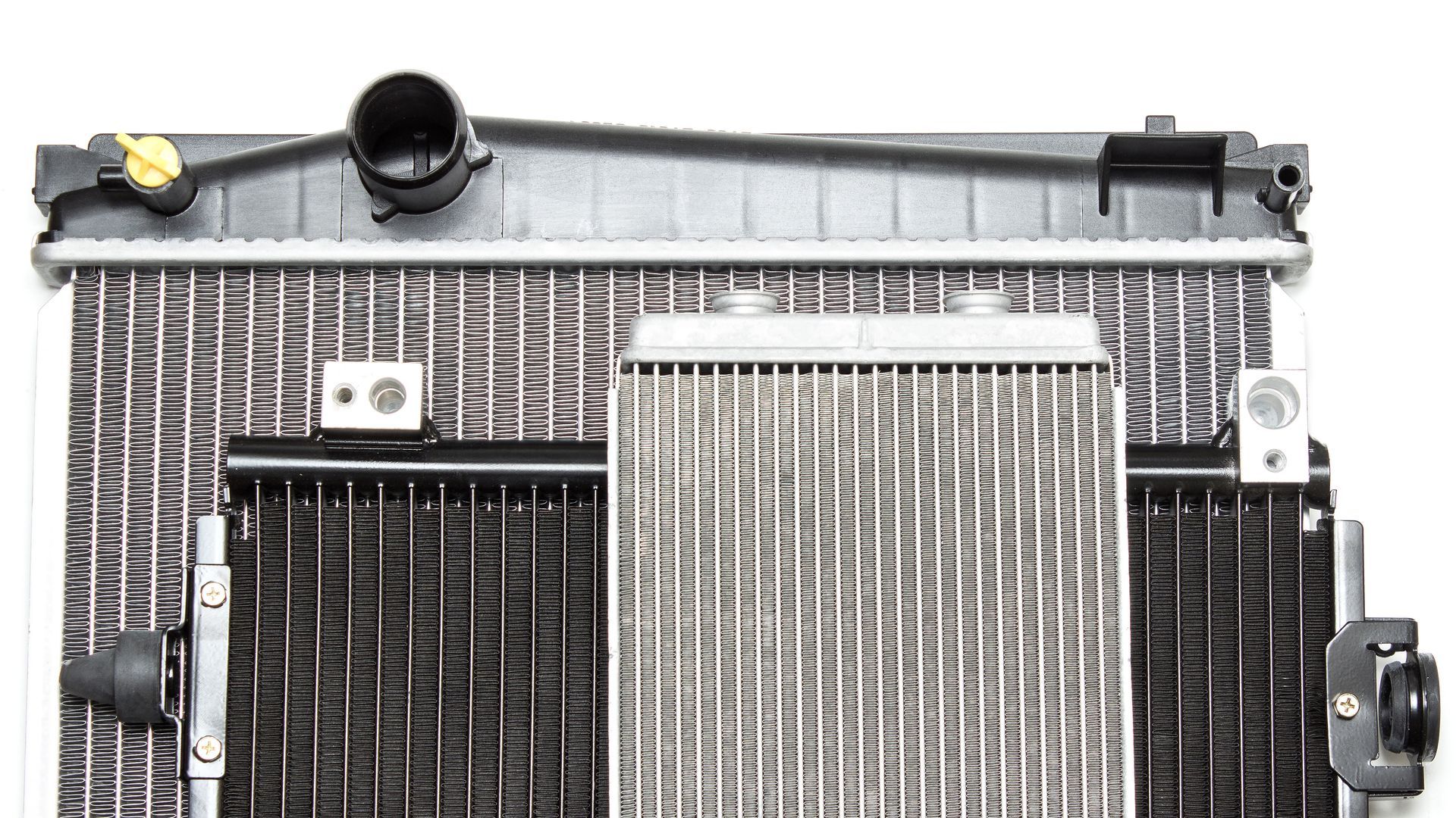 Row of stacked radiators and cooling parts in silver and black Row of stacked radiators and cooling parts in silver and black